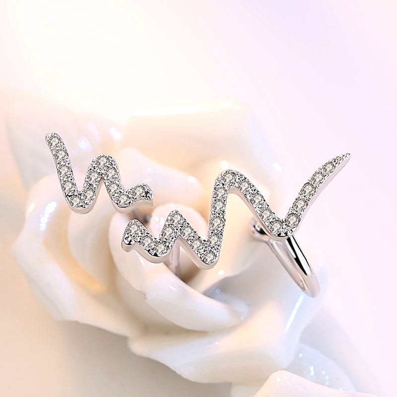 silver wave-shaped ring adorned with sparkling diamonds complements the silver necklace korean lightning design of the korean lightning necklace collection