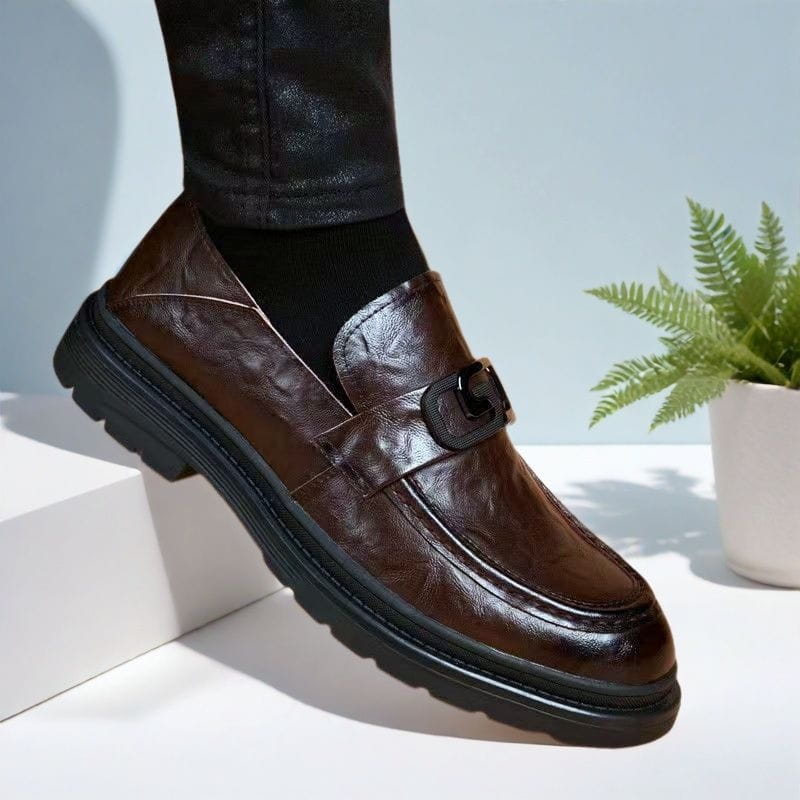 brown leather loafer with black buckle and thick rubber sole designed as business casual leather shoe