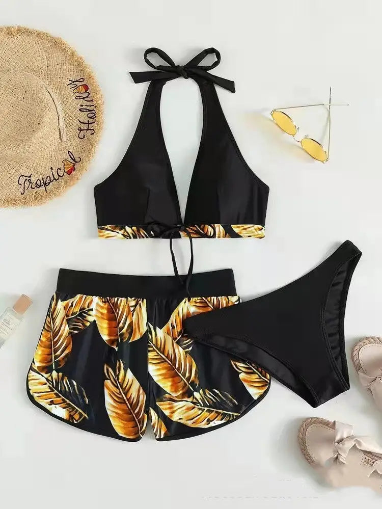 Black halter top leaf print bikini with gold leaf pattern and matching high waisted shorts in a 3pcs leaf print set for shorts fashion summer.