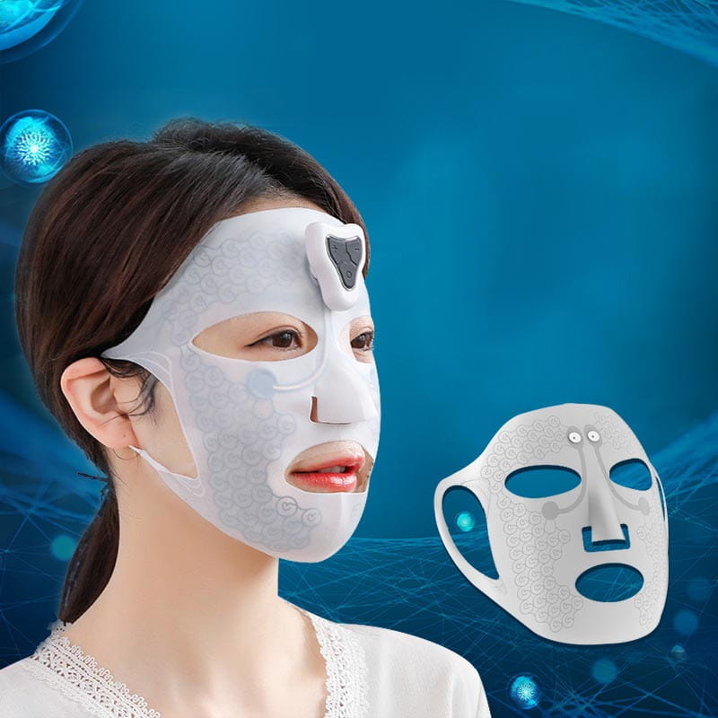 White electric facial massage mask with a subtle gray lace pattern and a black sensor pad on the forehead designed for facial massage use