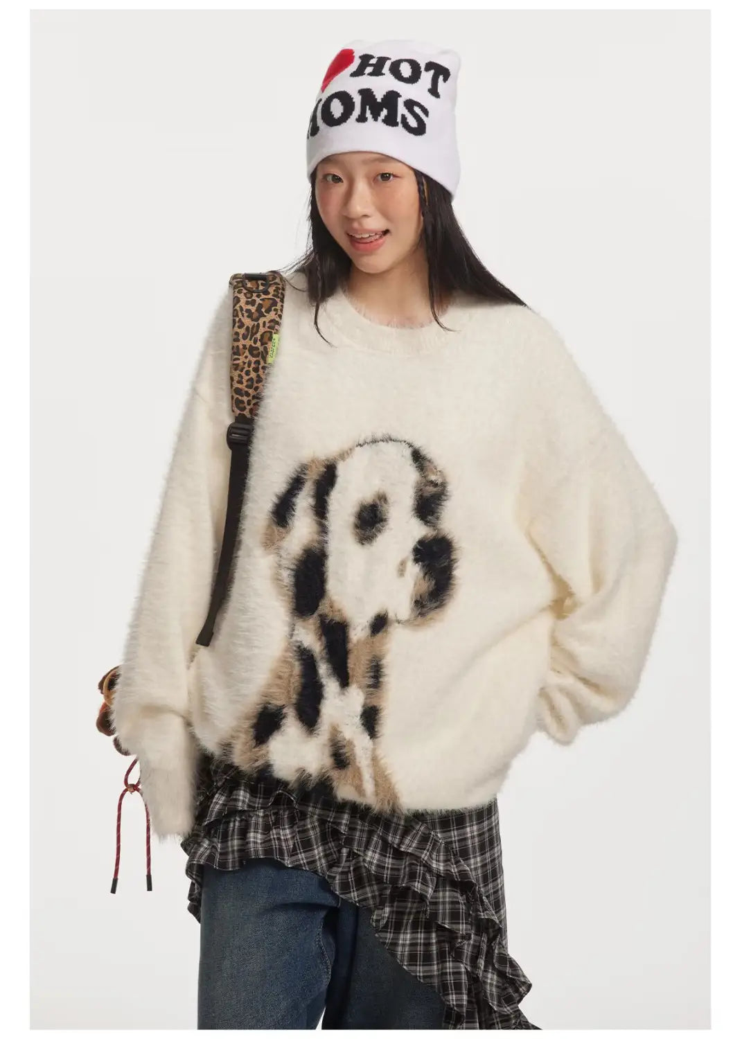 cream-colored fluffy mink cashmere knitted sweater featuring a prominent black and white dalmatian puppy jacquard mink design on the front