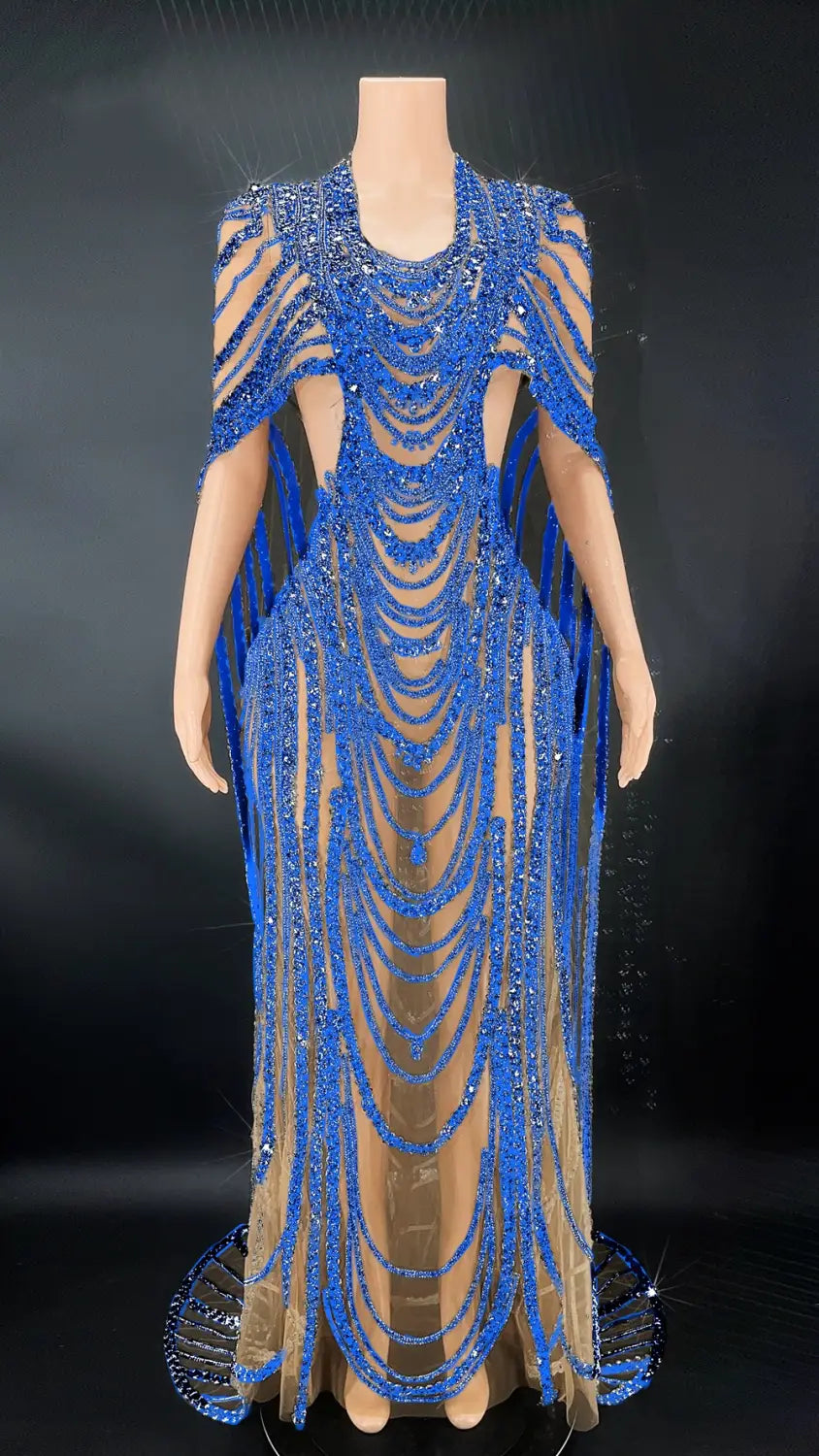 A dazzling royal blue celebrate crystal sequin evening gown featuring intricate cascading beadwork and sheer mesh panels.