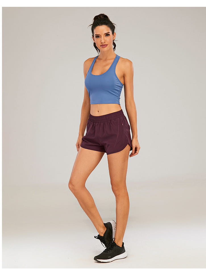 blue and maroon athletic two-piece set with a fitted crop top featuring racerback straps and light blue summer sports shorts with zipper pockets breathable and an elastic waistband