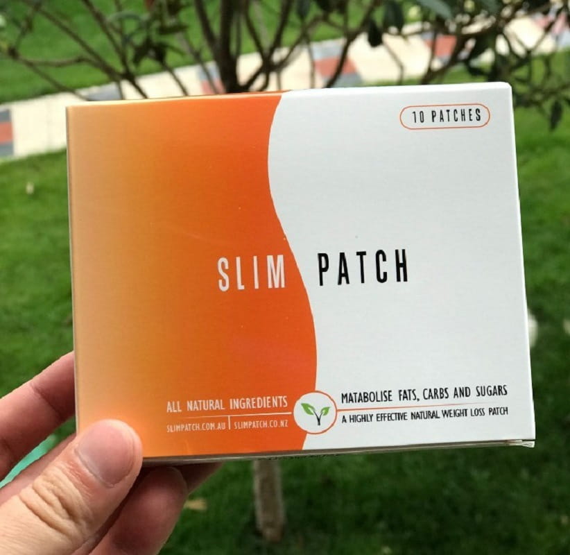 orange and white rectangular box labeled slim patch containing 10 natural weight loss patches for magnetic slimming navel belly button use and belly button patch slimming.