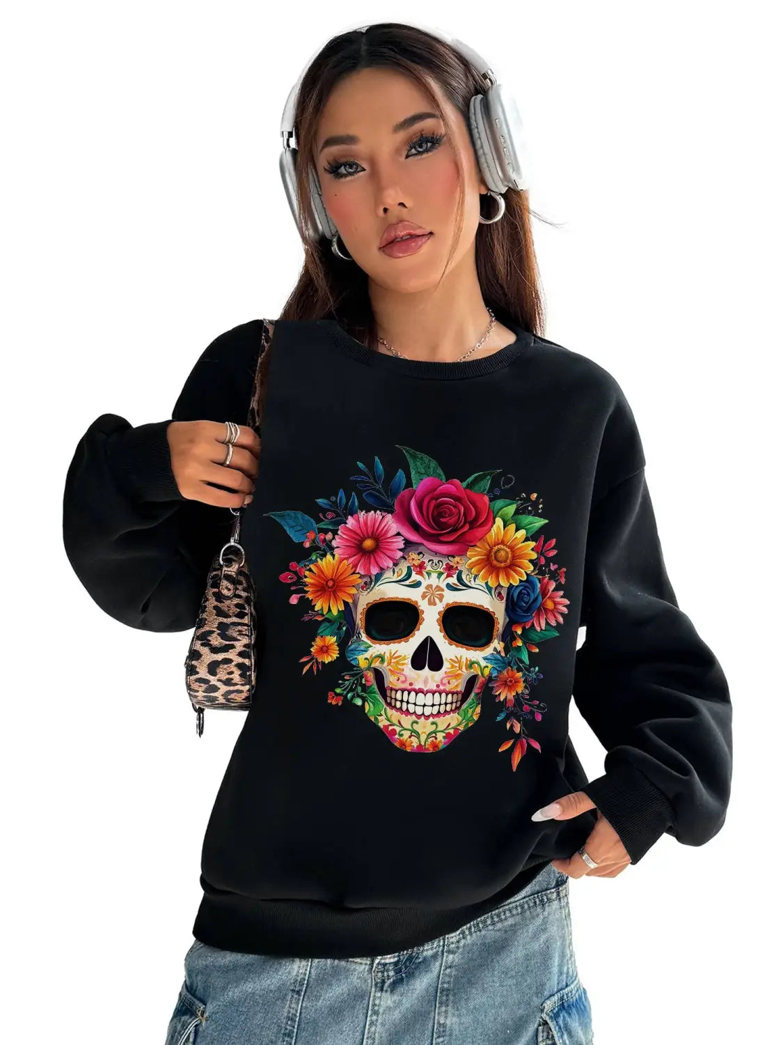 Black long-sleeve crew neck sweatshirt featuring a vibrant colorful floral sugar skull design ideal for daily wear.