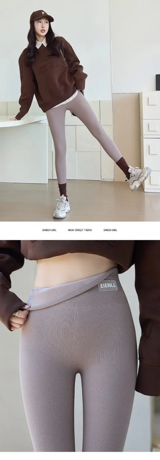 Gray ribbed threaded underwear leggings with a branded waistband label featuring high waist high elastic thread design for winter threaded underwear use.