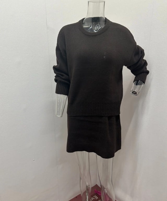 Black knit long sleeve sweater dress with ribbed cuffs and hemline, part of sweater skirt sets pieces knit casual collection.