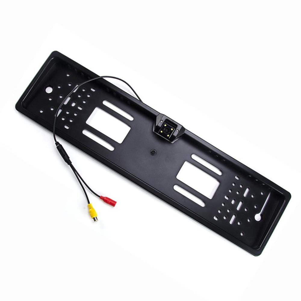 black plastic european license plate mount with integrated night vision camera and rca cable connectors shown from the back side