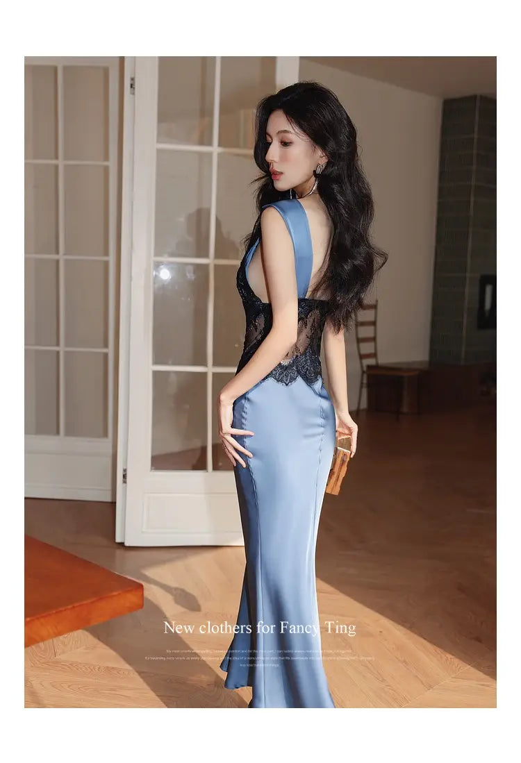 a sleek light blue sleeveless lace sheath dress featuring a plunging back and black lace detailing along the neckline in satin material