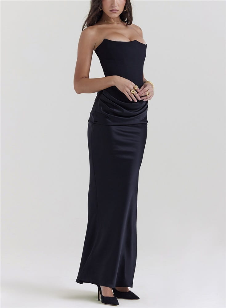 A sleek black satin strapless long dress sexy fashion bandeau mermaid gown with a fitted bodice and flowing skirt.