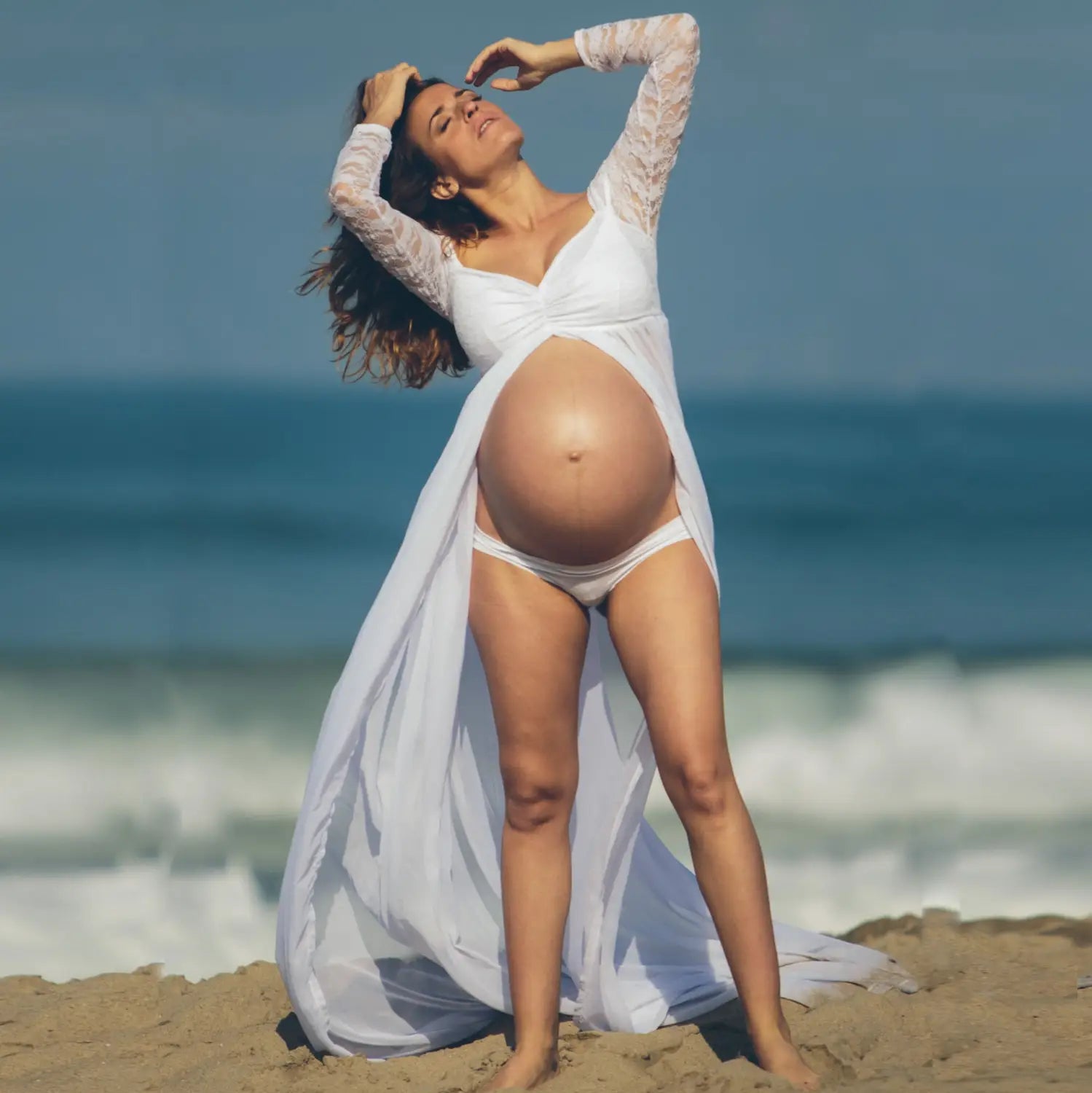 a flowing american white sexy long sleeve lace maternity dress featuring a draped design and lace as the main fabric