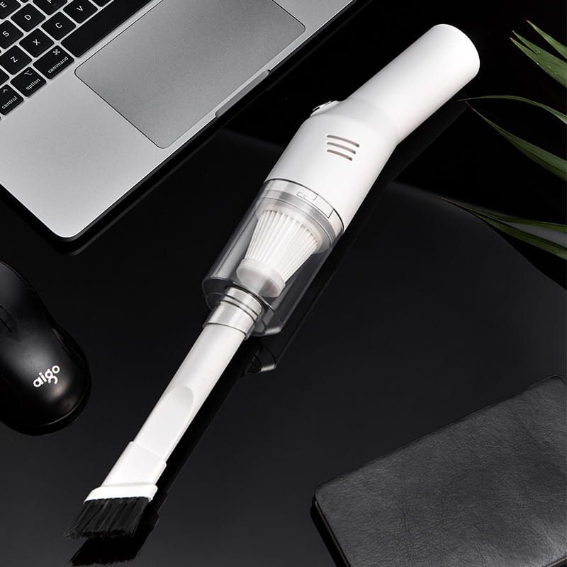 White portable wet dry car vacuum cleaner with transparent dust collection chamber and black brush attachment designed for versatile cleaning.
