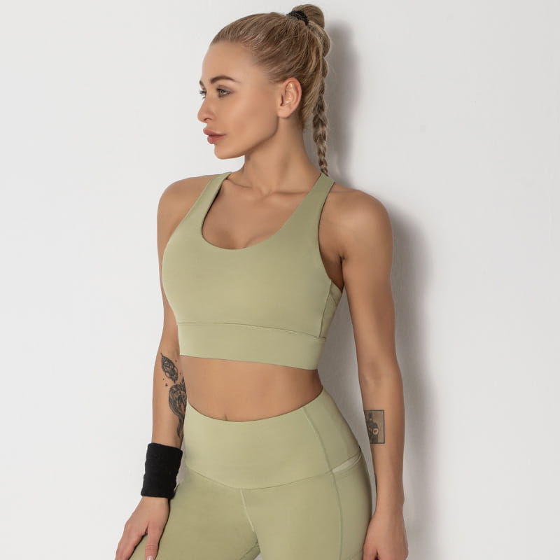 olive green seamless women’s shockproof running sports bra with racerback design paired with matching high-waisted leggings ideal for shockproof running yoga and other athletic activities