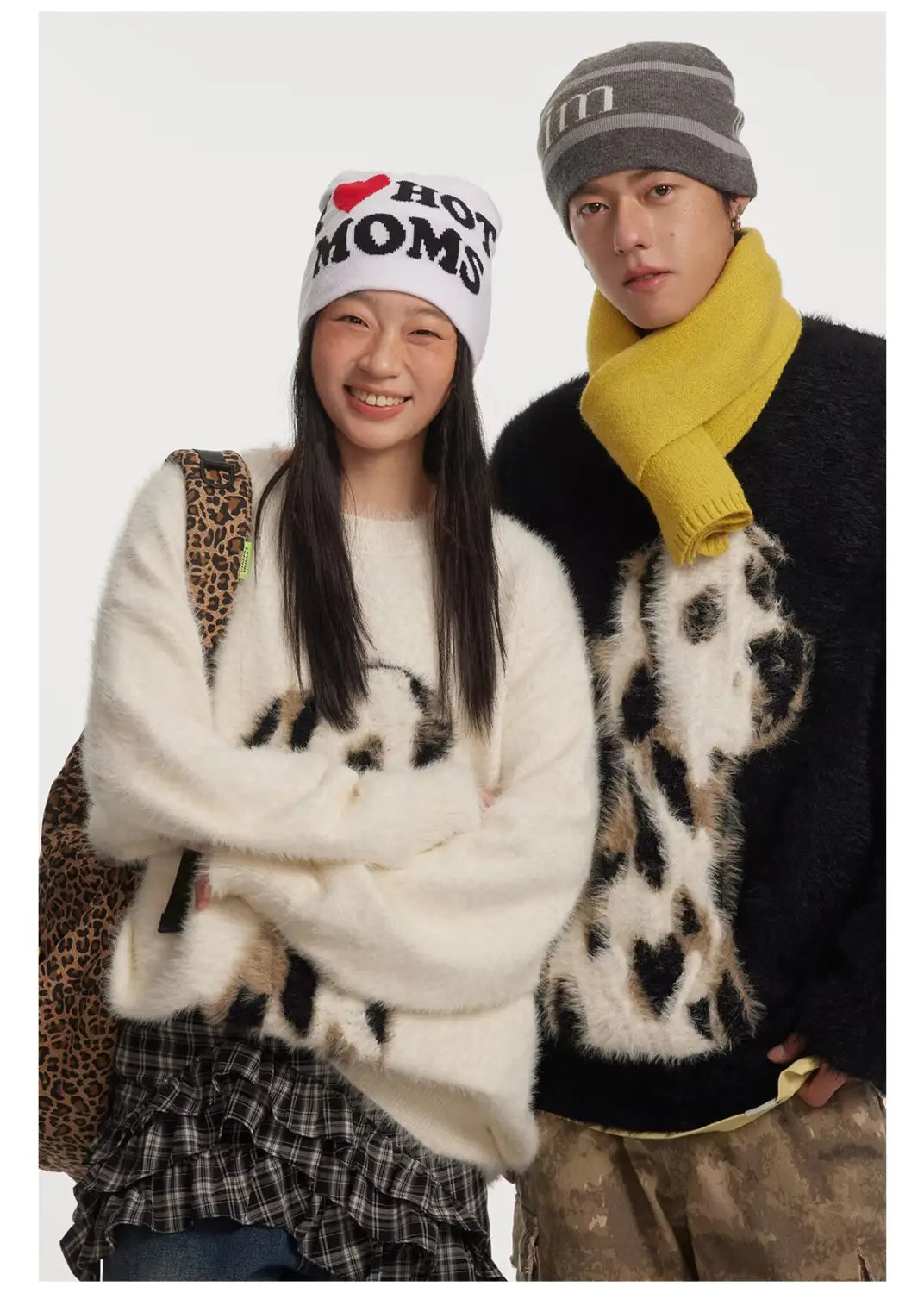 white fuzzy sweater featuring a black and white panda print made from jacquard mink cashmere knitted material showcasing the dalmatian puppy jacquard mink design