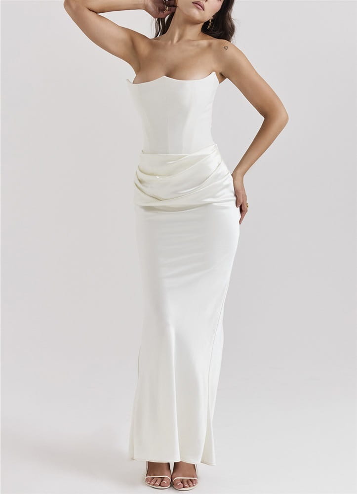 A sleek strapless white satin gown with a fitted bodice and flowing skirt showcasing a long dress sexy fashion bandeau mermaid style.