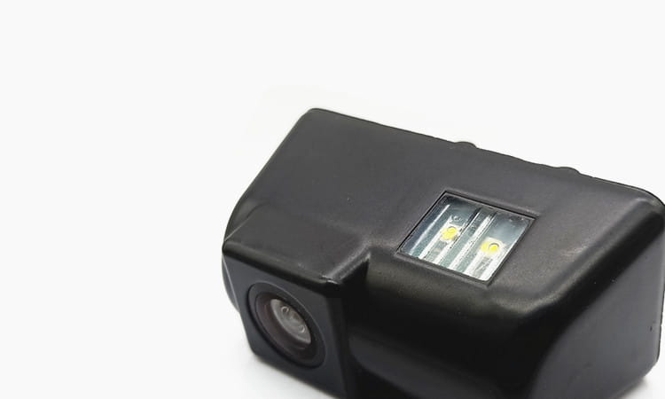 black plastic hd night vision reversing rear view camera with integrated led lights shown from the back side for enhanced night vision reversing use