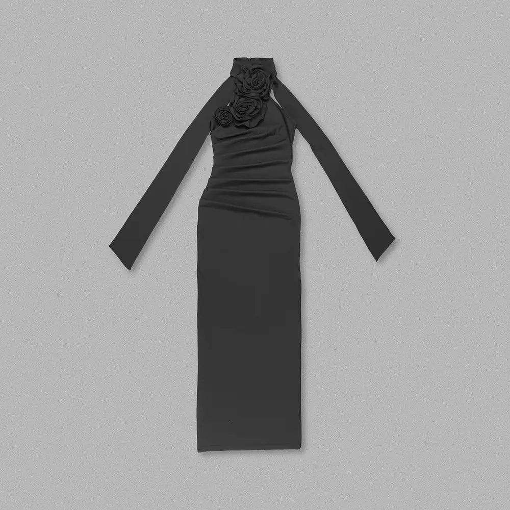 Black high-neck long sleeve dress featuring a floral embellishment at the neckline styled with a white ribbon flower halter detail.