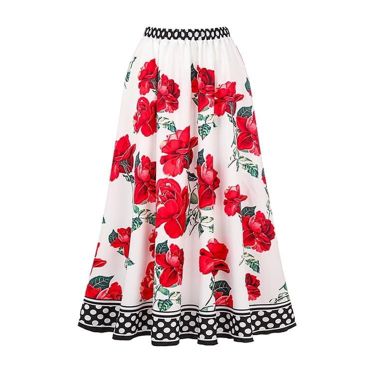 A white chiffon polyester printed floral midi skirt with bold red roses green leaves black braided waistband and polka dot trim at the hem in a floral chiffon polyester printed one piece swimsuit set.