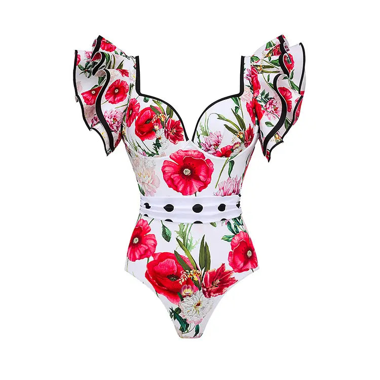 white one-piece chiffon polyester printed swimsuit featuring a vibrant floral pattern with red poppies and green leaves accented by black trim on ruffled shoulder straps and waistband