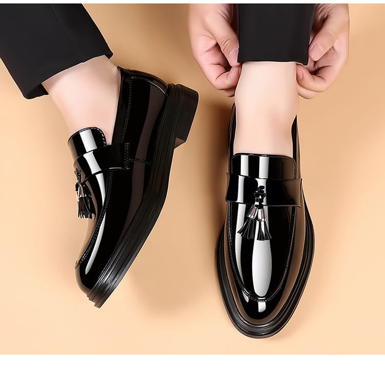 Black patent leather tassel business formal wear shoes featuring a glossy finish and contrasting silver-toned metal accents ideal for formal wear and leather shoes collections.