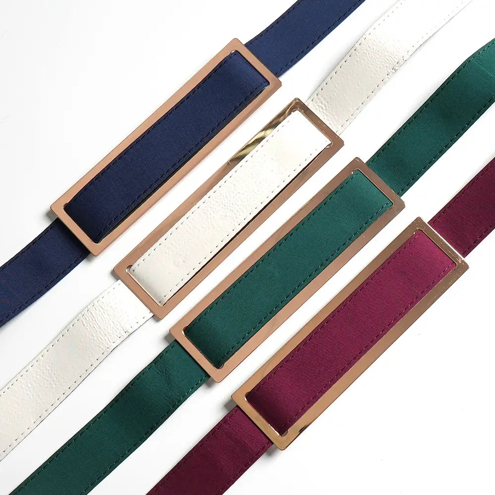 four satin-finish belts in navy white green and burgundy with rectangular rose-gold-toned metal buckles complement the solid color hot drilling plus size two piece set.