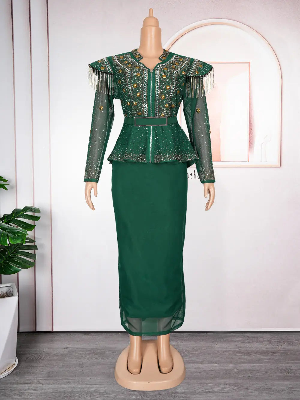 Emerald green solid color hot drilling two-piece set featuring a beaded sheer long-sleeved top with fringe detailing and a matching solid skirt.