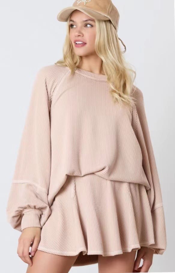 Beige ribbed knit two-piece women’s solid colour casual suit featuring a loose-fitting top and flared skirt designed for comfortable casual wear.