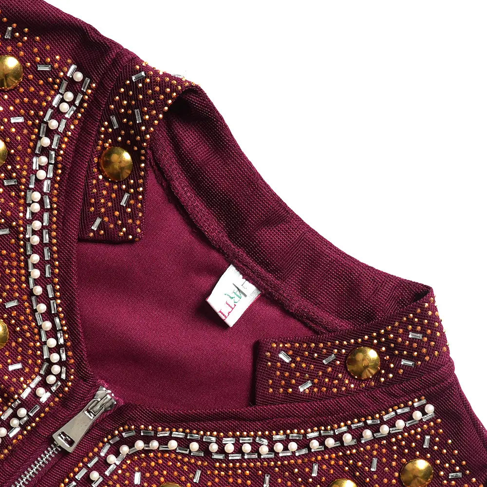 A maroon solid color hot drilling plus size two piece set jacket featuring intricate beadwork metallic studs and gold toned buttons along the collar and zipper line.