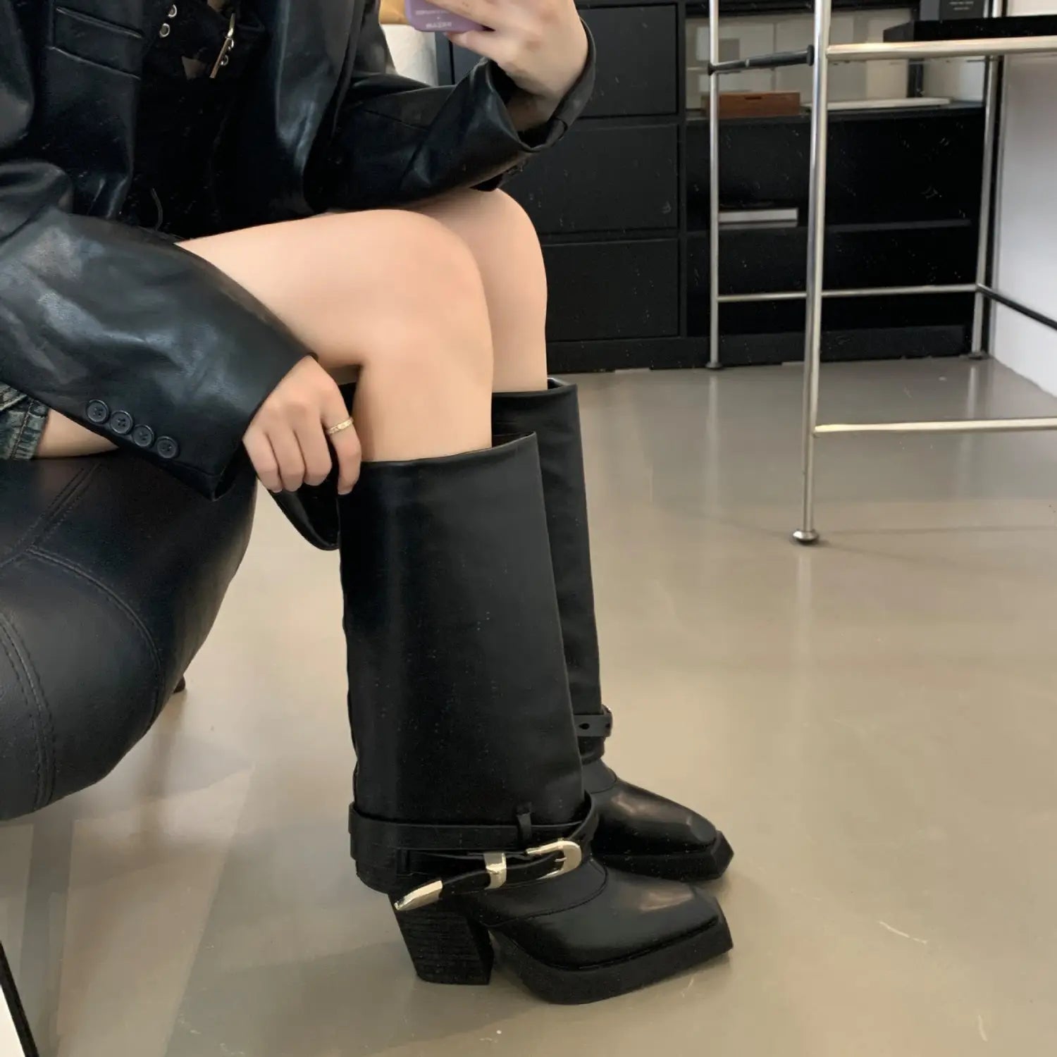 black pointed toe chunky heel knight boots featuring knee-high design, chunky heel, black leather material, and silver buckle detail suitable for winter pointed toe fashion.
