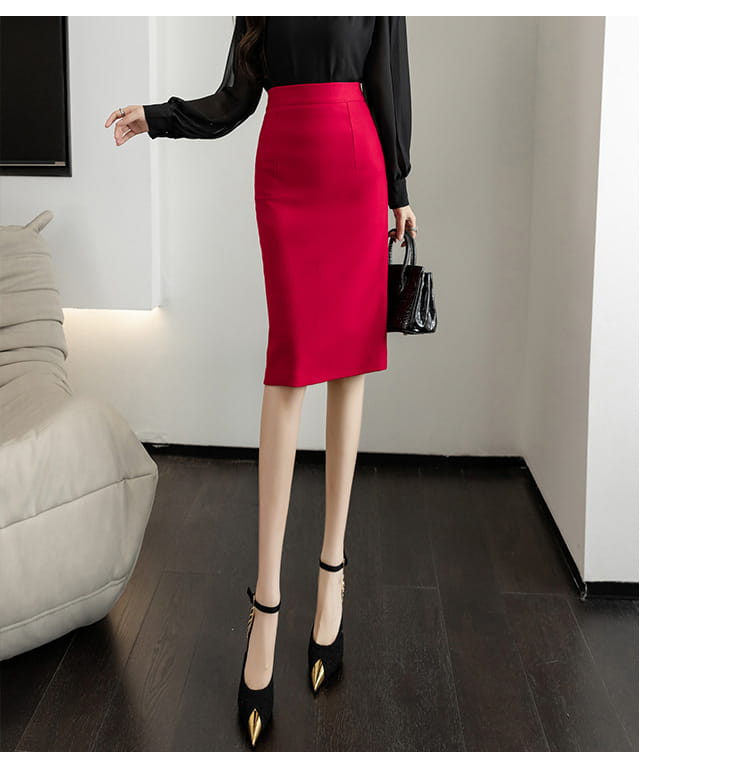 a vibrant red line sheath skirt made of smooth fabric with a form-fitting and elegant tight pencil cut and straight hemline.