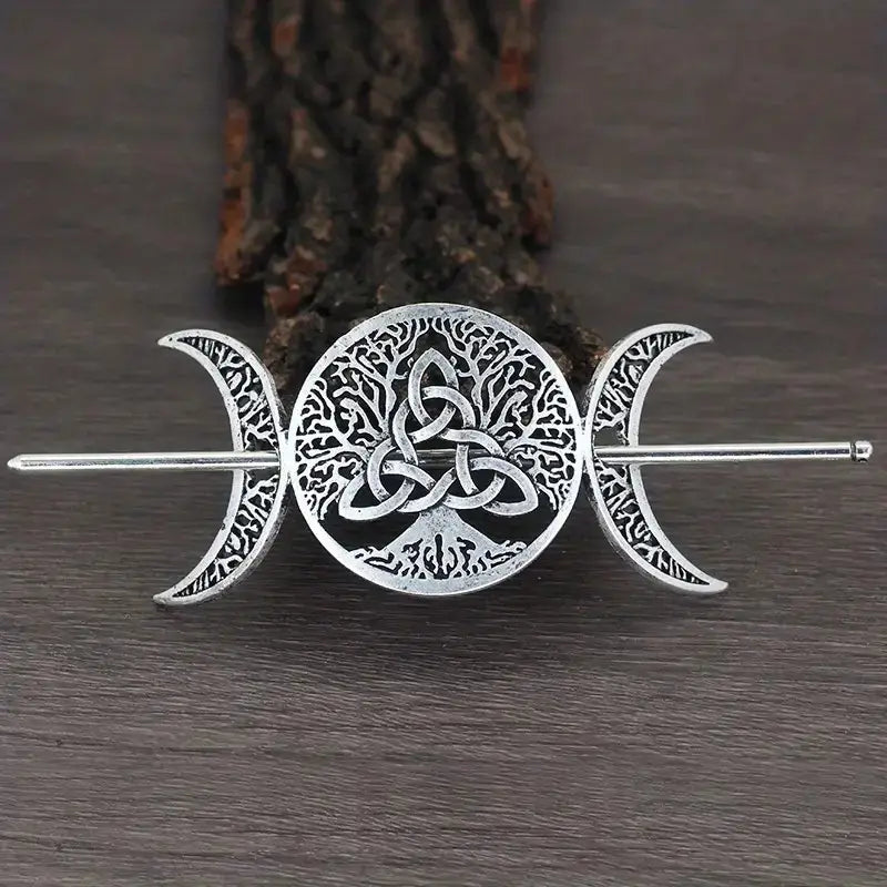 Silver-toned metal female viking barrettes featuring an intricate tree of life circular motif intertwined with celtic knots and flanked by detailed crescent moons made from animal alloy.