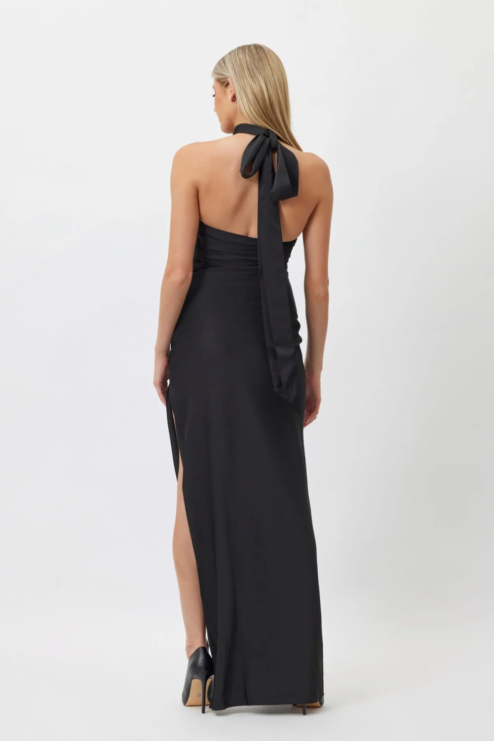 black satin halter gown featuring a back tie and side slit, highlighting the style white ribbon flower halter design.