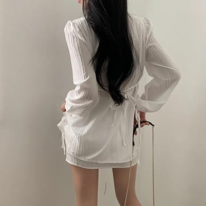 white ribbed long sleeve shirt dress featuring sheer fabric with ribbed texture and back tie detail