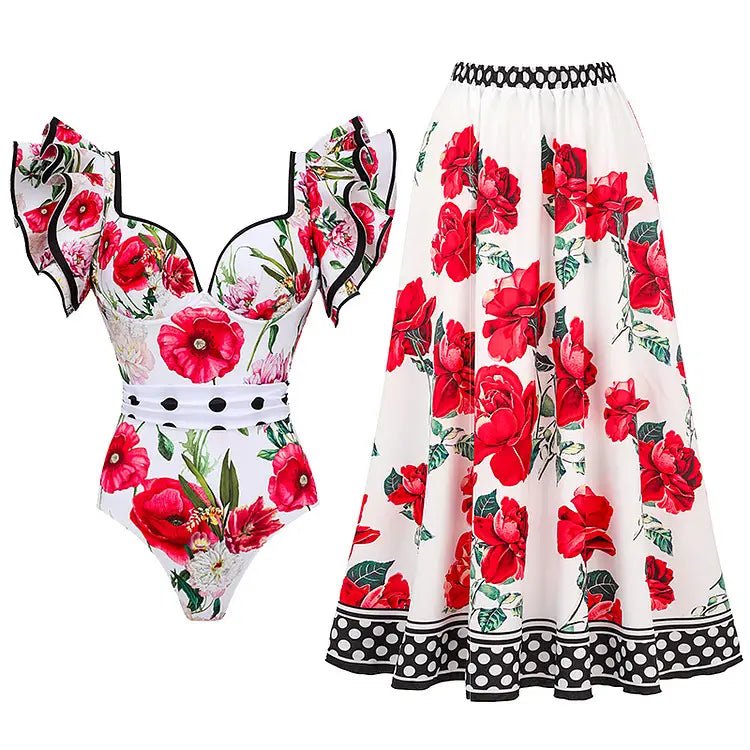 white one-piece swimsuit set with matching skirt featuring vibrant red floral chiffon polyester printed design with black trim and polka dot accents at the hemline and waistband
