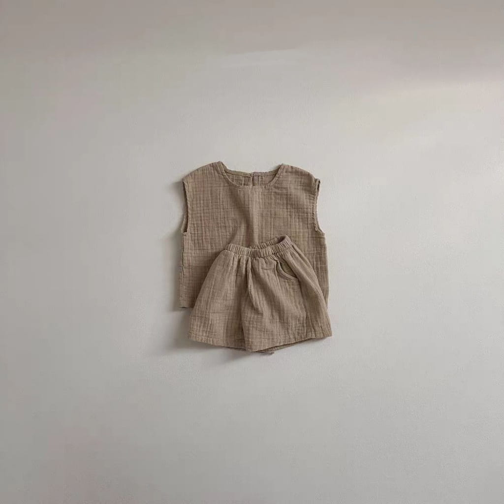 beige breathable vest shorts set made of lightweight textured cotton muslin fabric designed for comfort and breathability