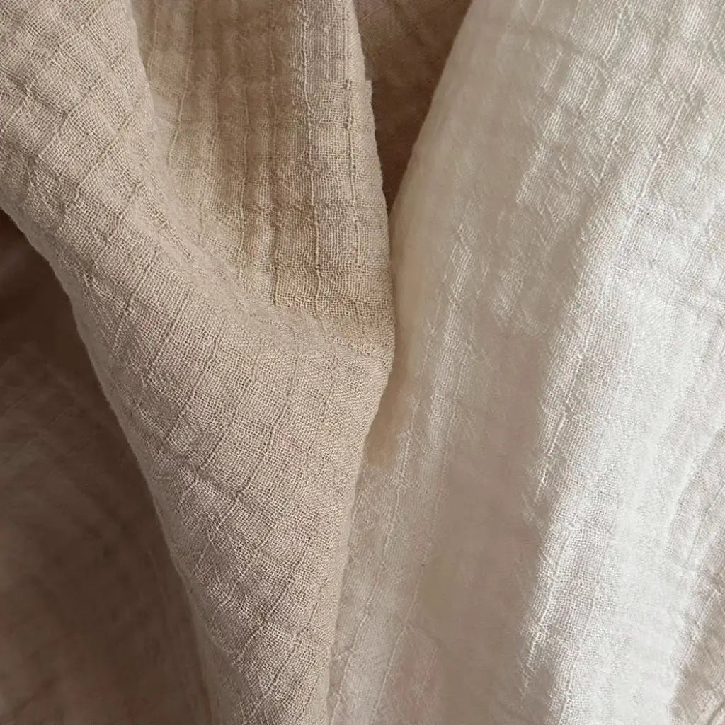 Soft off-white cotton muslin breathable vest shorts set featuring a subtle woven texture