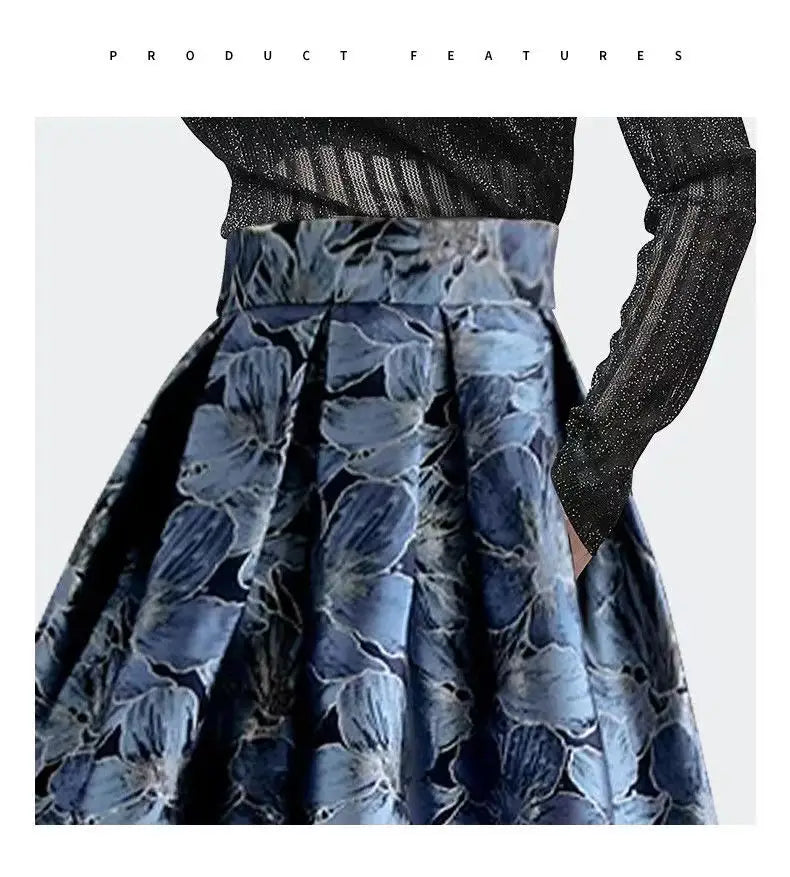 A high waist slimming jacquard floral midi skirt in navy blue with a bold pattern of intricate light blue and white blossoms on textured fabric.