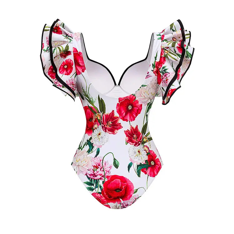 A white chiffon polyester printed one-piece swimsuit set featuring a vibrant floral pattern with red and pink poppies and black ruffled shoulder straps.