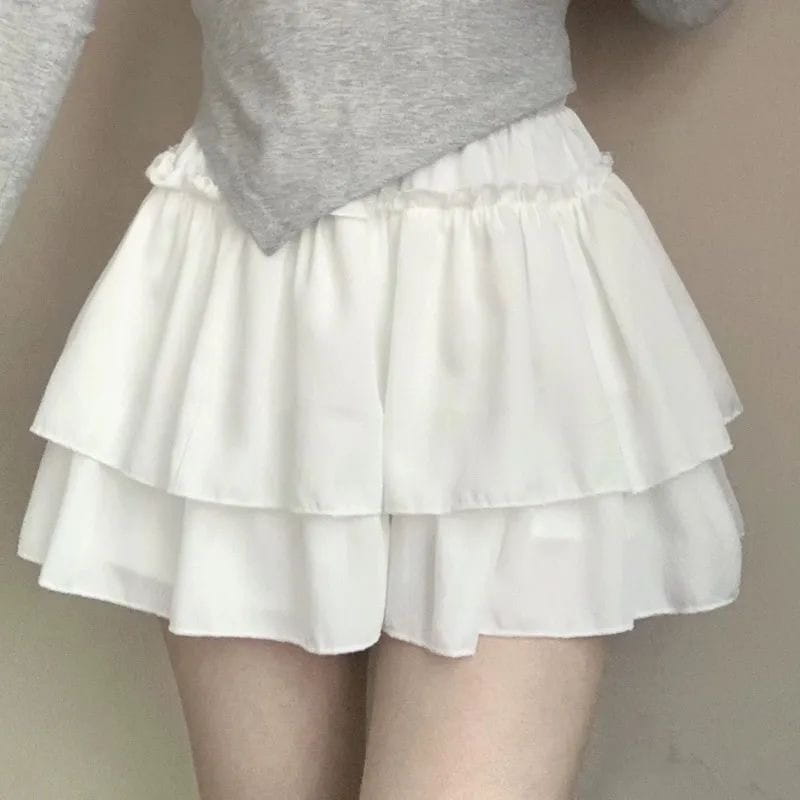 white tiered ruffle pure desire style pettiskirt with soft flowing fabric and elastic waistband designed as a slimming ballet style pettiskirt.