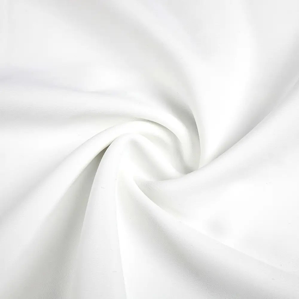 white smooth satin fabric with subtle sheen and gentle folds used in a satin white ribbon flower halter gown emphasizing the ribbon flower halter style