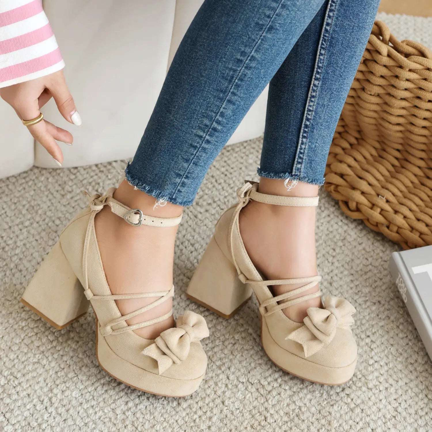 beige suede platform lolita heels featuring ankle straps and small size bows as decorative accents