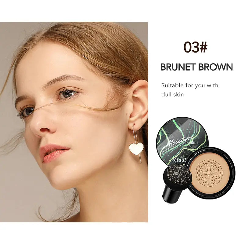 Ivory marbled air cushion foundation with sponge featuring a brunet brown cream foundation compact and a black and green marbled lid with a beige powder base inside.