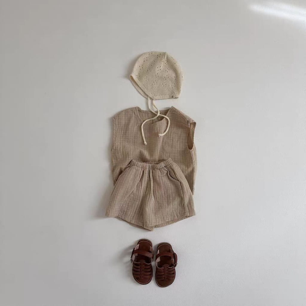 beige linen breathable vest shorts set with matching knitted hat and brown leather sandals for baby comfort