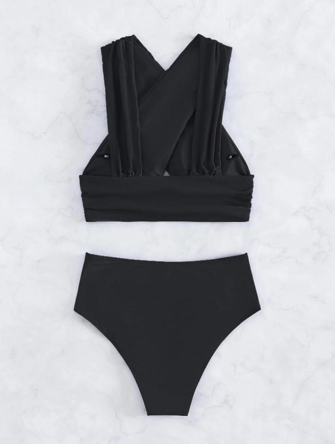 black two-piece swimsuit featuring a solid colour cross halterneck top with a pleated swimsuit design and high-waisted bottoms shown from the back side