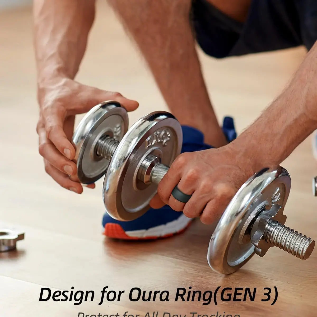 silver dumbbell with chrome-plated metal plates and threaded steel rods featuring a sleek reflective finish shown alongside an oura ring 3rd gen silicone protector case for smart ring protection