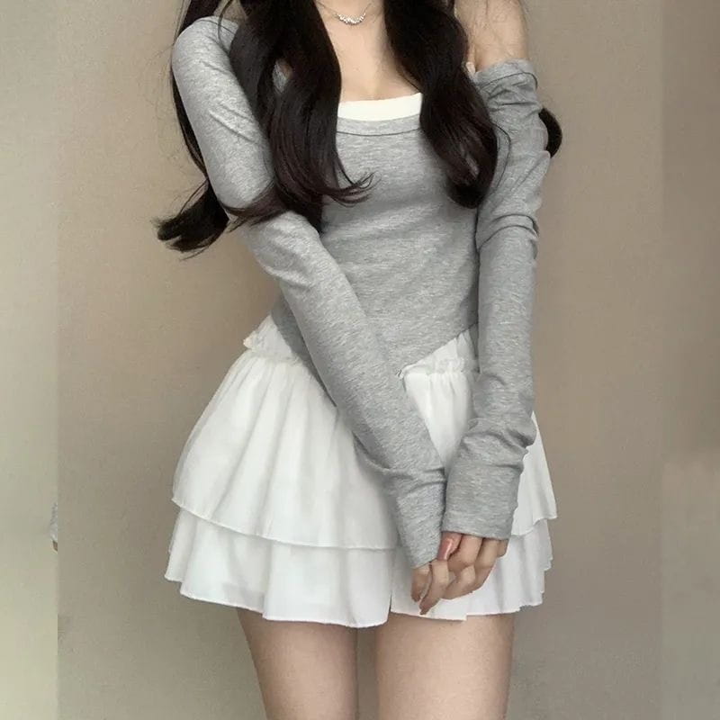 gray long-sleeved top with off-the-shoulder design and subtle texture worn over a white tank top paired with pure desire style pettiskirt slimming ballet skirt