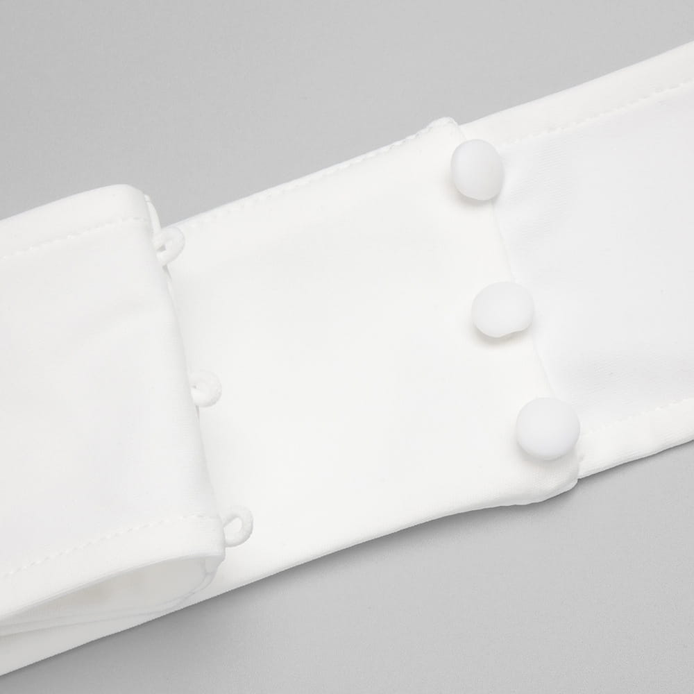 white cotton blouse sleeve with three matching round buttons detail on satin white ribbon flower halter gown