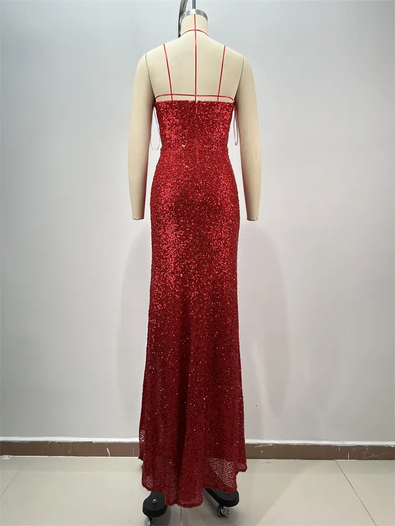 a shimmering red paillette tube gown with thin straps, high slit, and a fitted silhouette in floor-length design