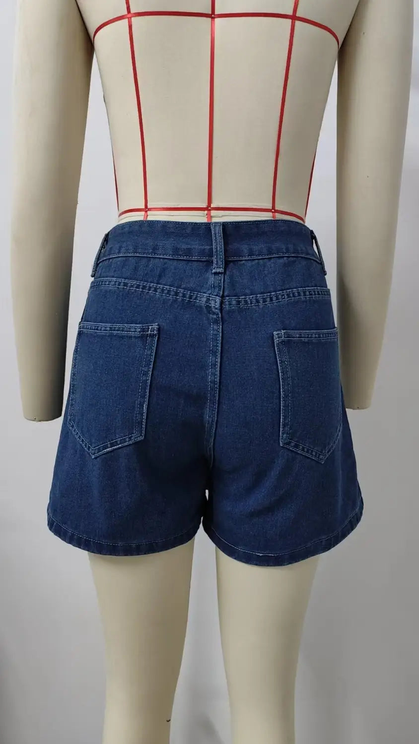 dark blue high waist washed irregular denim short skirt showing classic back pocket design on the back side