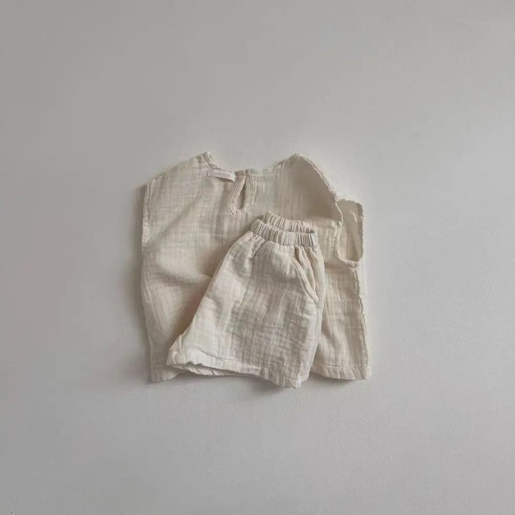 cream-colored breathable vest shorts set made of lightweight cotton muslin for babies providing comfort and ventilation